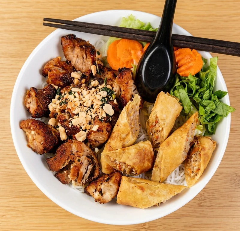 Vermicelli bowl with charbroiled chicken and spring rolls at Ha Long Bay, downtown Calgary